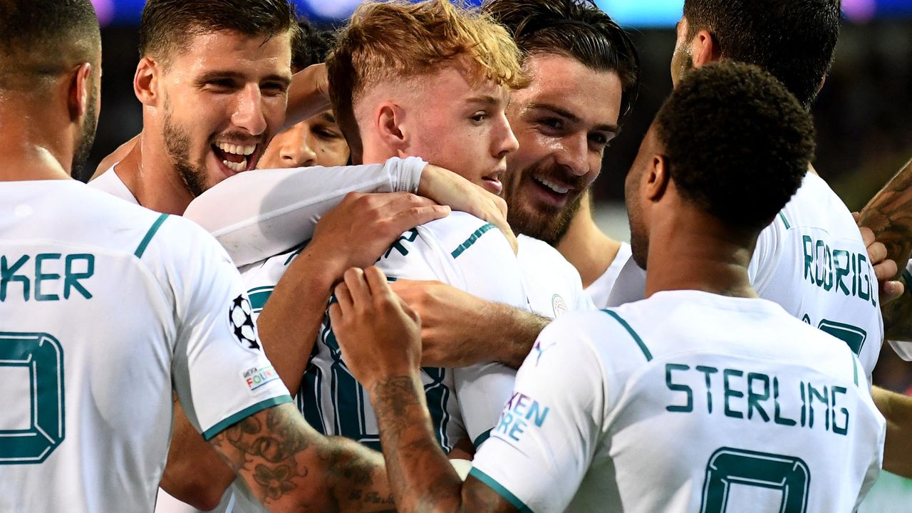 Jogadores do Manchester City comemoram gol marcado contra o Brugge