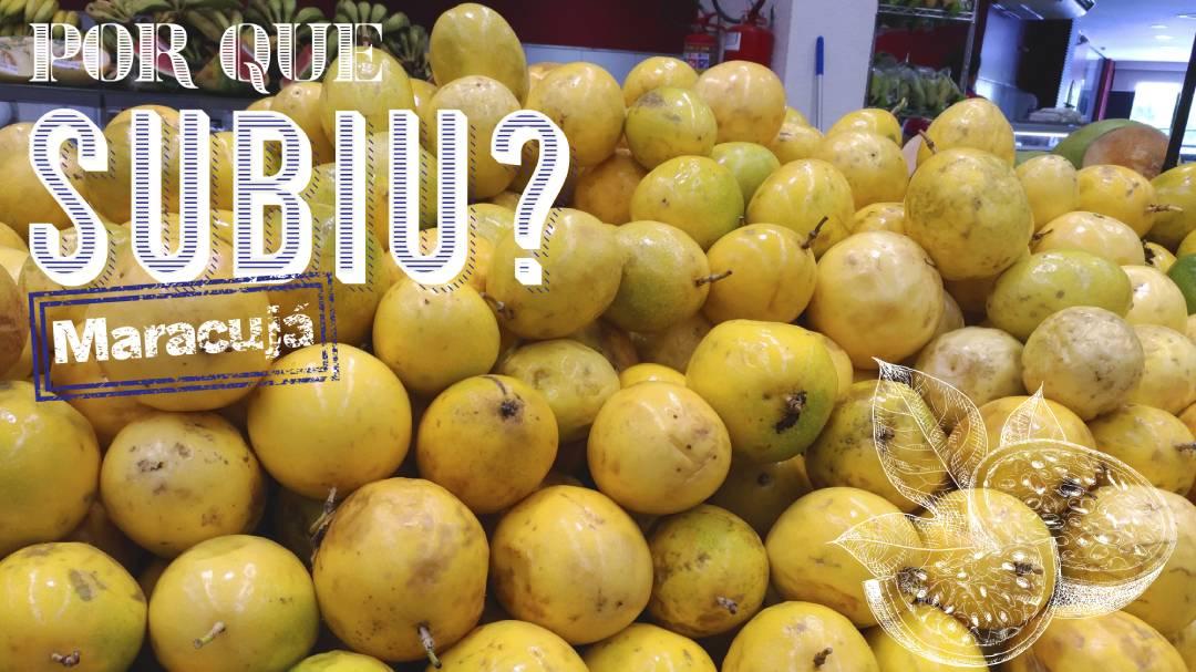 Pilha de maracujá em exposição em supermercado. Ao fundo é possível ver um extintor e algumas paredes do estabelecimento.