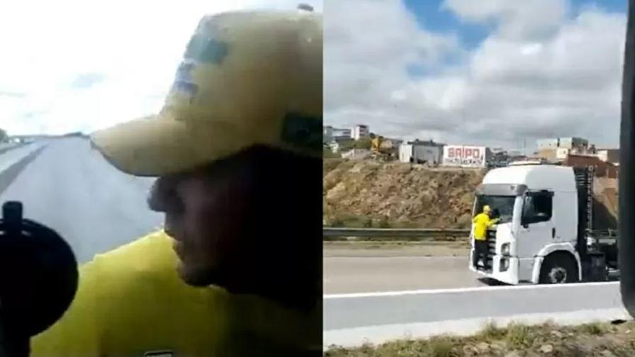 Homem de verde e amarelo agarrado em caminhão