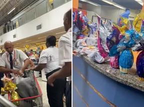 seguranças de supermercado com sacolas de itens furtados por grupo no rio de janeiro