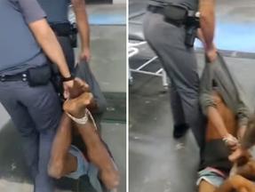 Policiais militares carregam homem com pés e mãos amarrados a uma corda