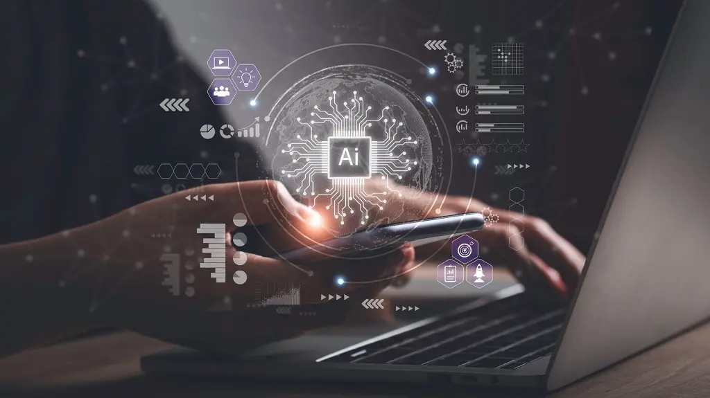 Imagem conceitual de uma pessoa segurando um celular, com close na mãe, enquanto aparece AI, de Inteligência Artificial, no centro da imagem.