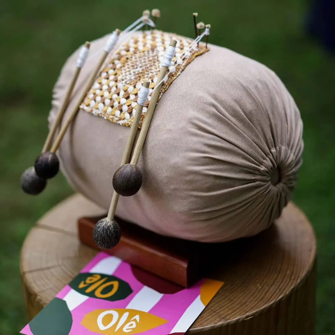 Foto que contém renda de bilro