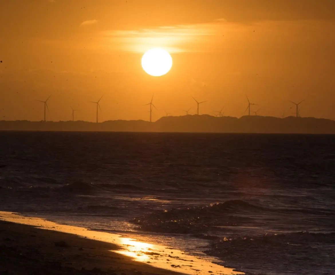 Foto que contém pôr-do-Sol