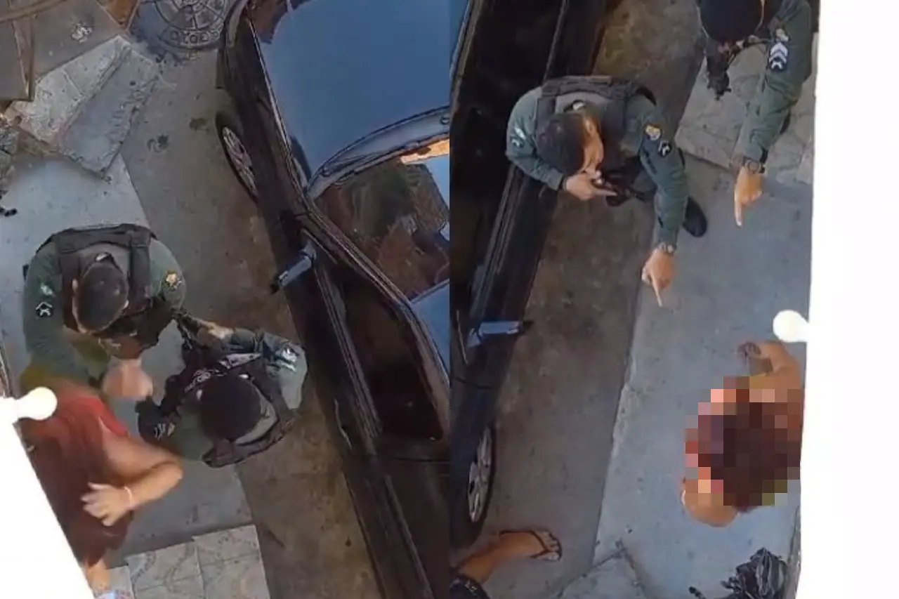 print de vídeo onde policiais abordam mulher e um deles empurra ela