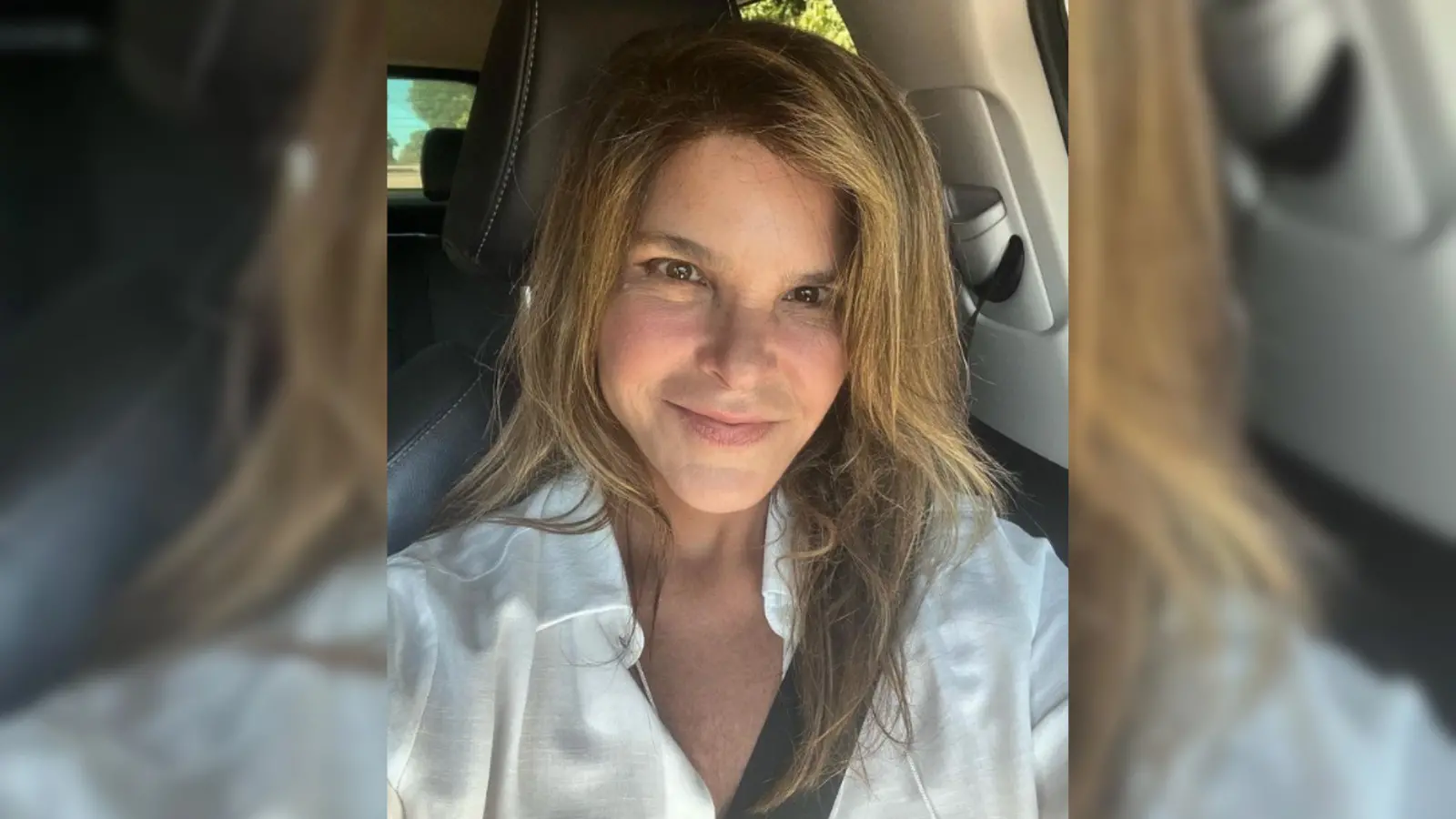 Cristiana Oliveira é uma mulher branca de cabelos compridos castanhos e olhos pequenos