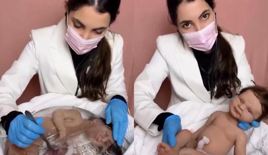 Mulher segura bebê reborn para matéria sobre influenciadora se assustar com repercussão de vídeo de parto de bebê reborn