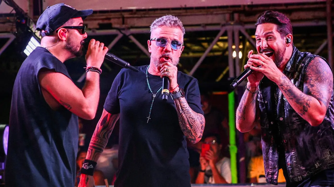 No centro da imagem, Tuca Fernandes ao lado de Tomate e Felipe Pezzoni