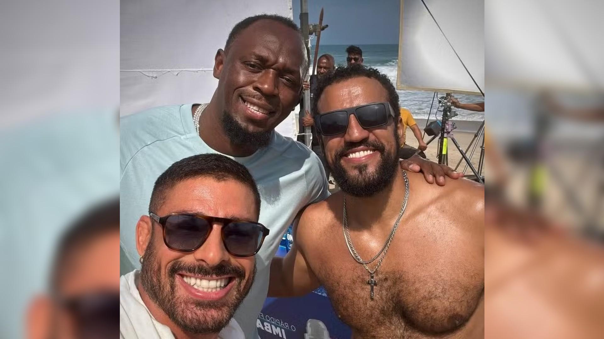 foto de Usain Bolt, Cauã Reymond e Ricardo Teodoro durante gravações da novela Vale Tudo, da TV Globo