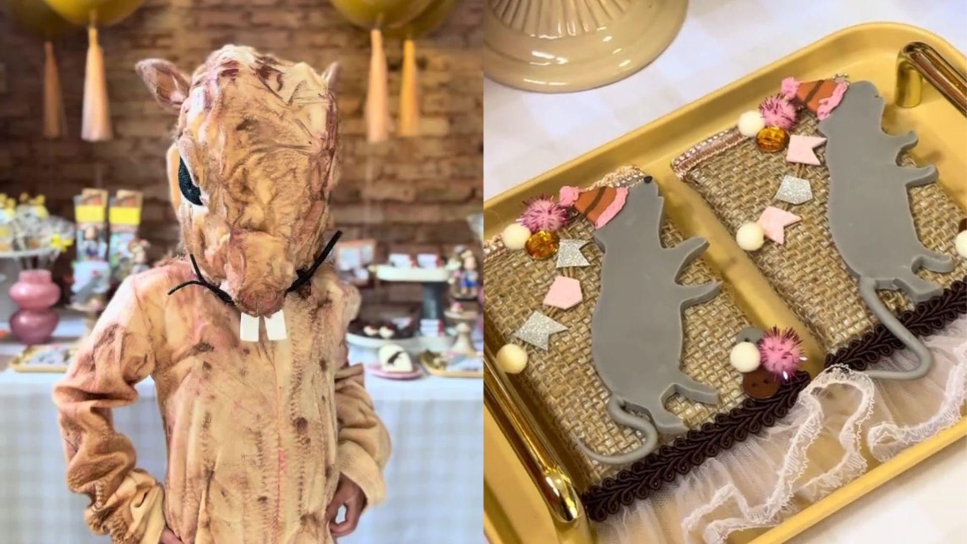 Imagem de uma pessoa vestida com fantasia de rato, ao lado de uma bandeja decorada com temas de rato, incluindo objetos decorativos e lembrancinhas, ideal para festas infantis
