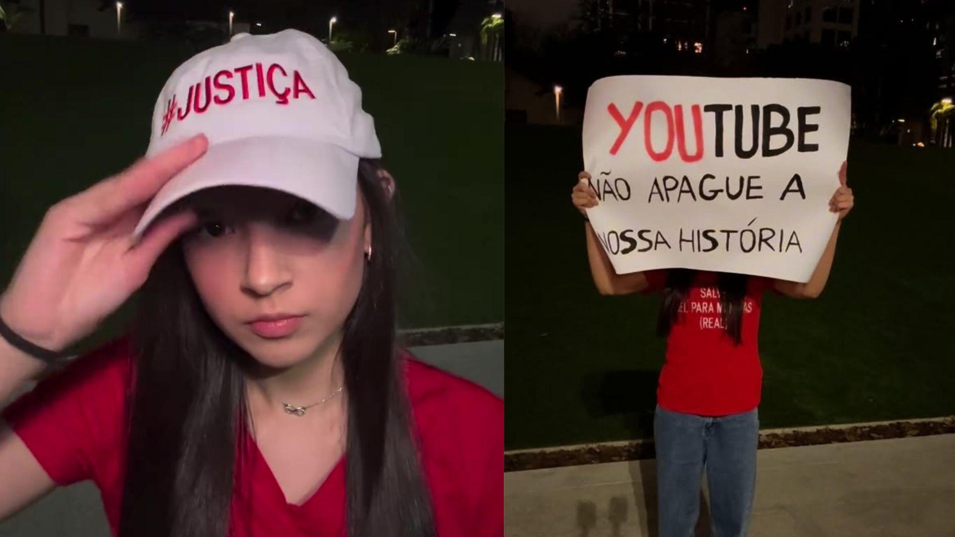 Mulher com boné branco com escrito #JUSTIÇA e camiseta vermelha, ao fundo, uma pessoa segurando cartaz que diz 'YouTube não apague a nossa história', em campanha por justiça social.