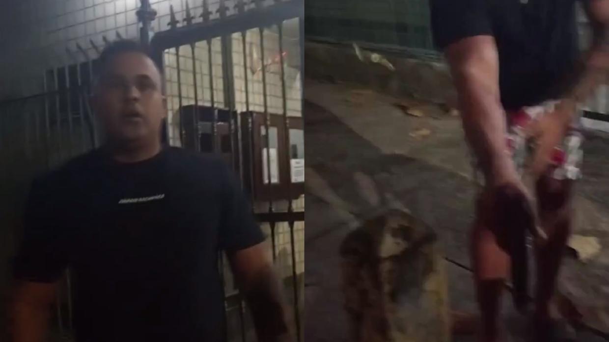 Imagem dividida em duas partes. À esquerda, um homem de camiseta preta está de frente para a câmera, em frente a um portão de grade metálica, com expressão séria. À direita, vê-se parte inferior do corpo do mesmo homem com bermuda estampada, segurando uma arma de fogo apontada para baixo. O chão está sujo com o que parece ser sangue e há folhas secas espalhadas.