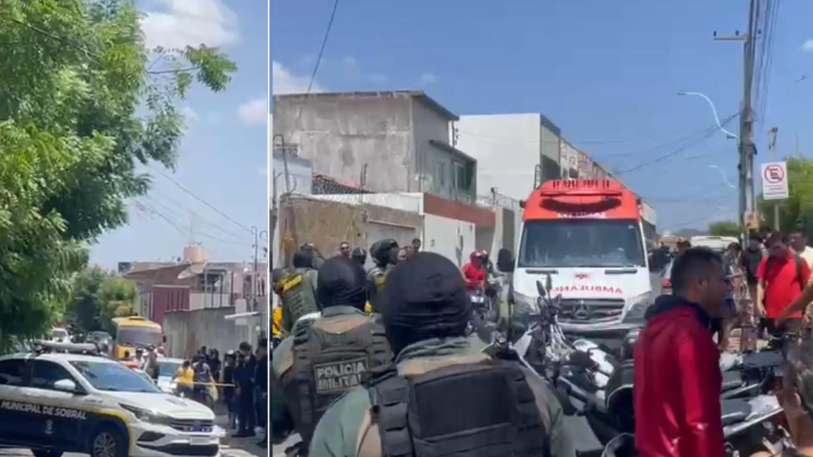 Policiais militares e guardas municipais isolam área em rua de Sobral após ataque a tiros, com ambulância do SAMU e várias pessoas acompanhando a ocorrência.