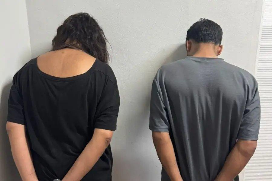 Foto de costas do casal suspeito de matar Luiz Fernando Pacheco