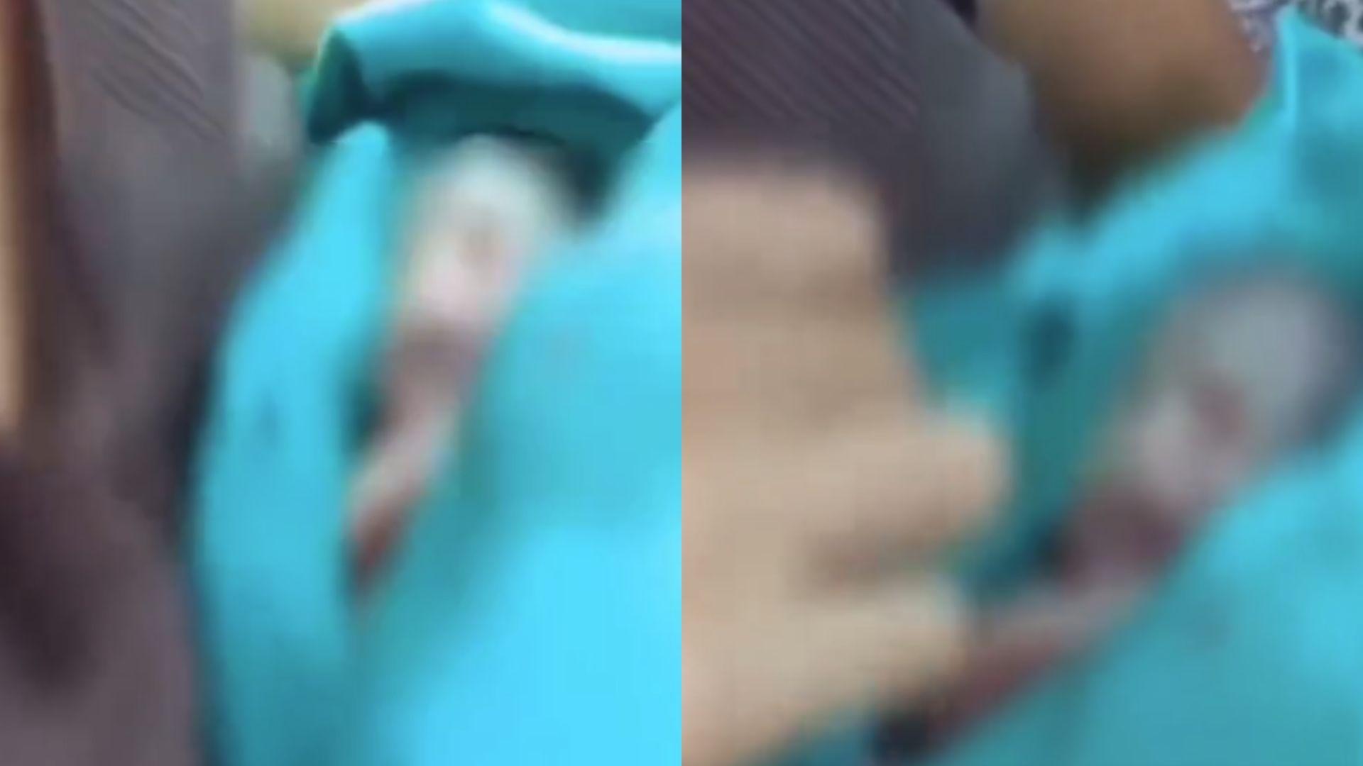 Capturas de tela do vídeo do bebê dado como morto em Rio Branco, em um saco plástico.