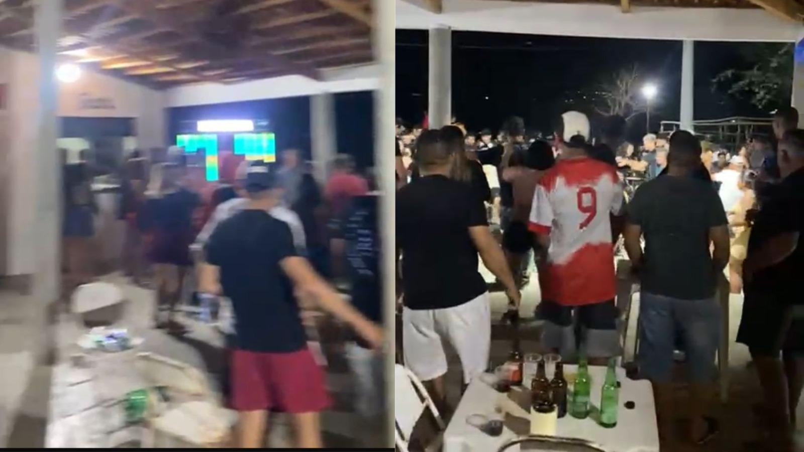 Imagens de uma festa lotada em um espaço coberto, com várias pessoas em pé e mesas com garrafas e copos. O ambiente está movimentado e iluminado por luzes artificiais durante a noite.