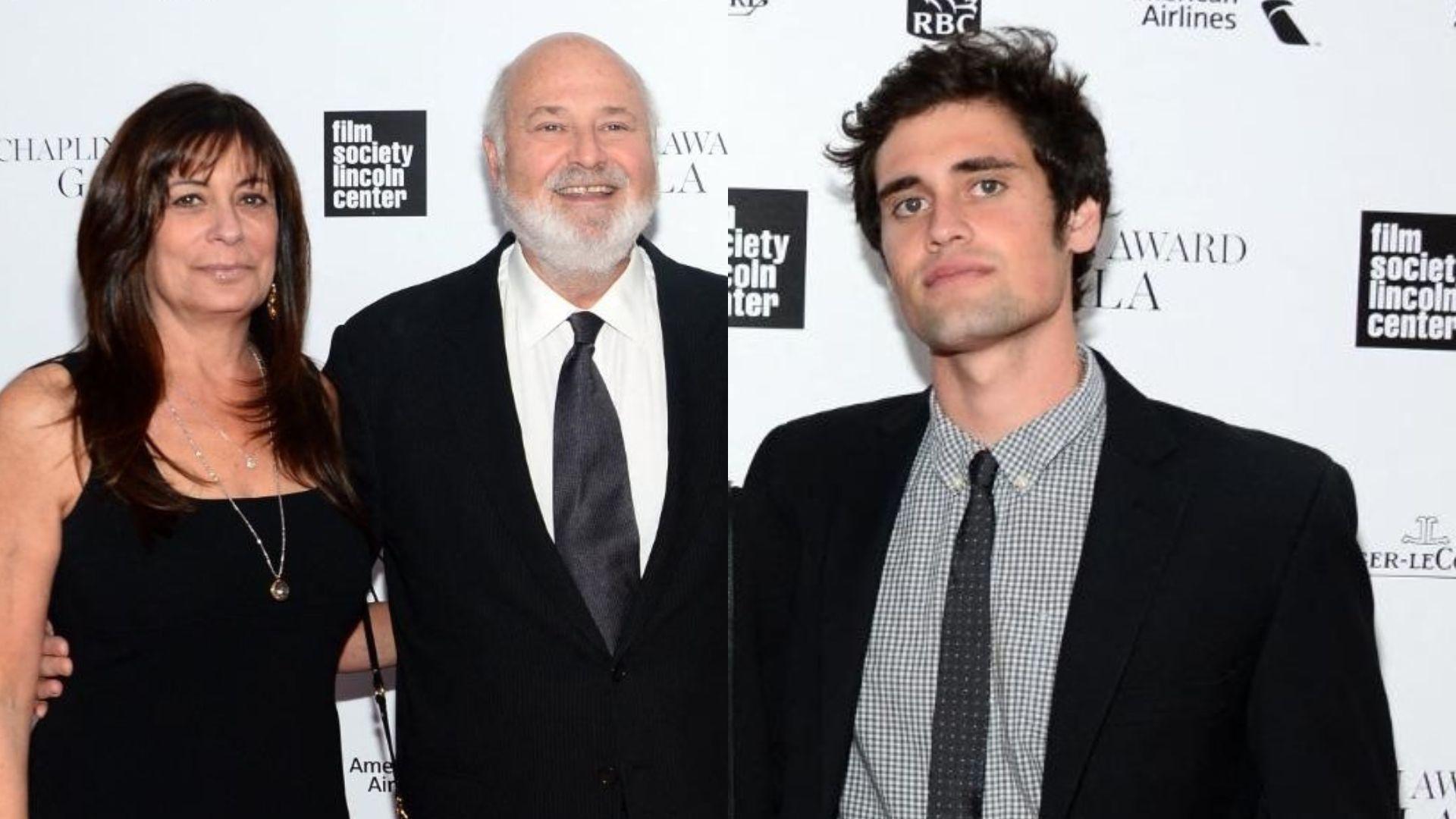 Três pessoas posando em um evento formal com fundo de parede branca estampada com logotipos de patrocinadores e organizadores, incluindo 'film society Lincoln center', 'Chaplin Award Gala' e marcas como RBC e American Airlines. As pessoas estão vestidas com roupas sociais, incluindo ternos e vestido preto, em um ambiente de gala.