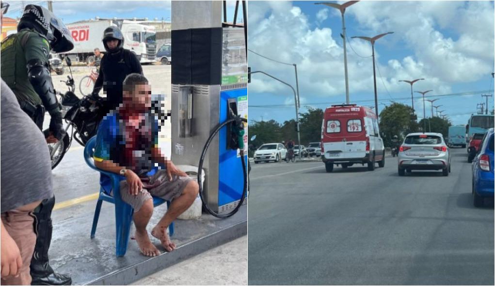 Homem com o corpo ensanguentado está sentado em uma cadeira de plástico em um posto de combustível, com o rosto desfocado. Ao lado, policiais militares com capacetes e motocicletas prestam atendimento no local. A cena ocorre em área externa do posto, com bombas de combustível e veículos ao fundo.