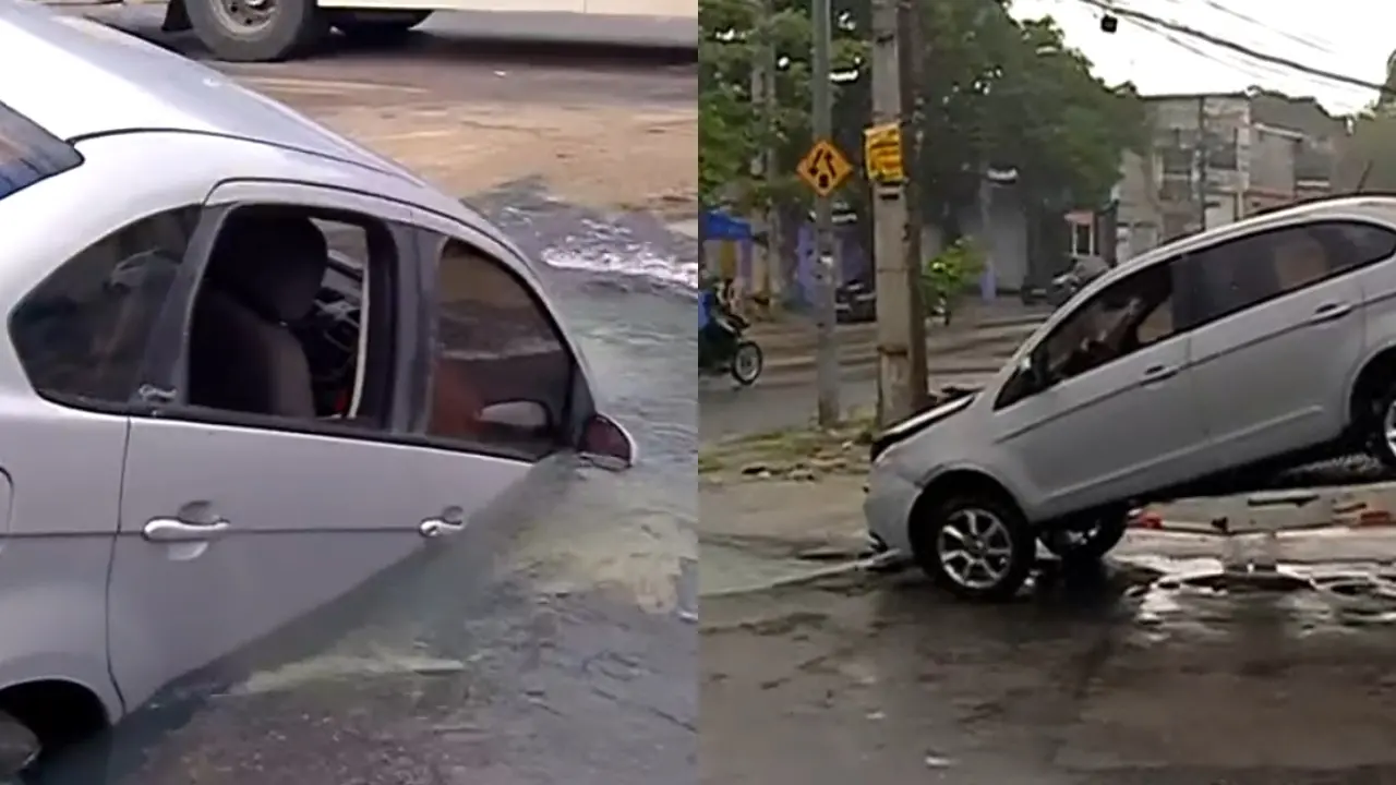 Veículo ficou 'engolido' por cratera em via pública.