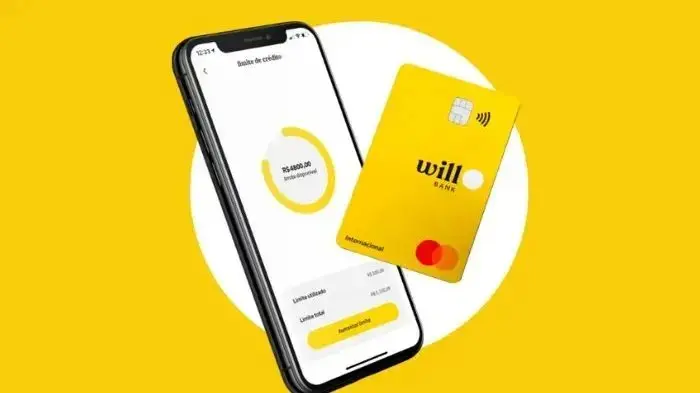 Cartão amarelo do Will Bank e foto do app. Imagem usada em matéria sobre FGC irá pagar até R$ 1 mil a 6 milhões de clientes da instituição bancária.