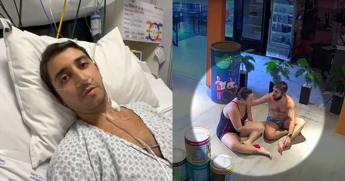 Paciente em um hospital olhando para a câmera, enquanto duas pessoas conversam na sala de espera ao fundo, longe da cama.