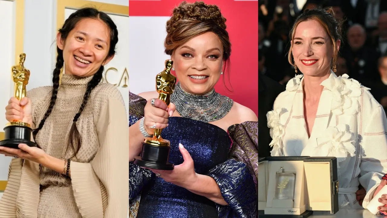 Diretora Chloé Zhao, figurinista Ruth E. Carter e produtora Emilie Lesclaux sorriem em uma montagem de fotos com prêmios cinematográficos. As duas primeiras, respectivamente uma mulher chinesa e uma mulher negra, seguram estatuetas douradas do Oscar, enquanto a terceira, uma mulher branca, posa com um prêmio do Festival de Cannes.