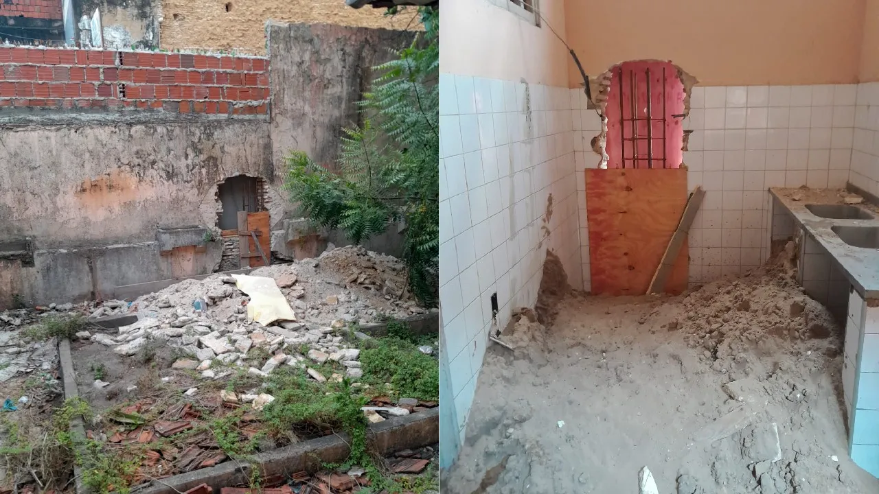 Área de entrada de prédio estava com entulho e com cômodos com parede quebrada com areia.