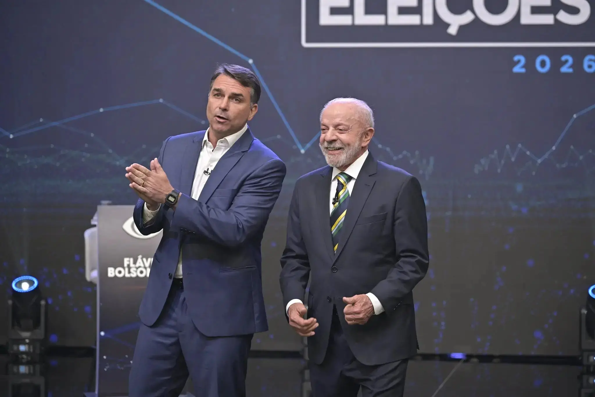 Imagem da notícia Flávio Bolsonaro e Lula vão para o debate na Globo? Veja o que disseram os candidatos