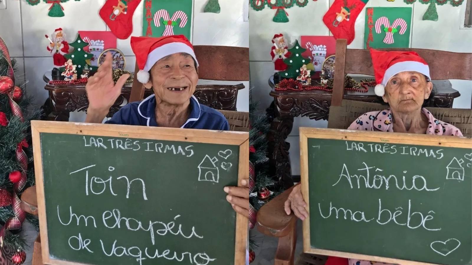 Idosos residentes do Lar Três Irmãs seguram placas com desejos de Natal