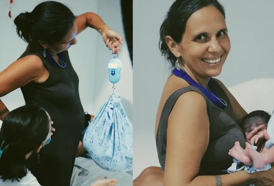 A parteira tradicional Thatiane Terra, 44, com um bebê