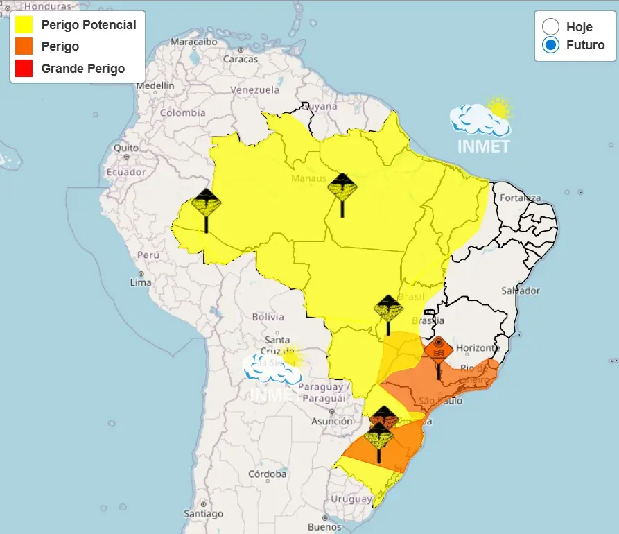 Mapa da América do Sul com destaque para o Brasil, mostrando áreas de risco meteorológico segundo o INMET. A legenda indica três níveis: Perigo Potencial (amarelo), Perigo (laranja) e Grande Perigo (vermelho). A maior parte do Brasil aparece em amarelo, cobrindo regiões Norte, Centro-Oeste e parte do Sudeste. Há áreas em laranja principalmente no Sudeste e Sul, incluindo regiões próximas a São Paulo, Rio de Janeiro e Paraná. Ícones de alerta meteorológico estão distribuídos em algumas áreas. No canto superior direito, há a opção “Hoje” e “Futuro”, com “Futuro” selecionado, além do logotipo do INMET.
