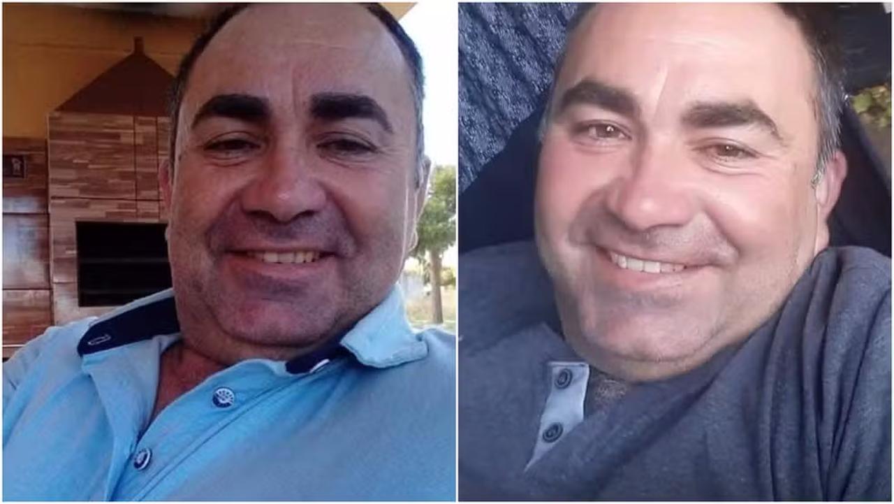 Foto de um homem sorridente em ambientes internos, usando camisa azul e escuro, com cabelos curtos e expressão amigável.