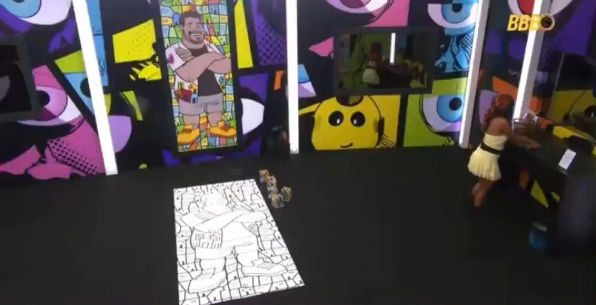 Gabi durante a pintura do painel.