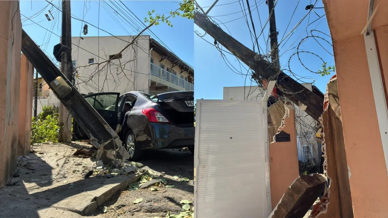 Poste também atingido pela árvore caiu no muro da casa.